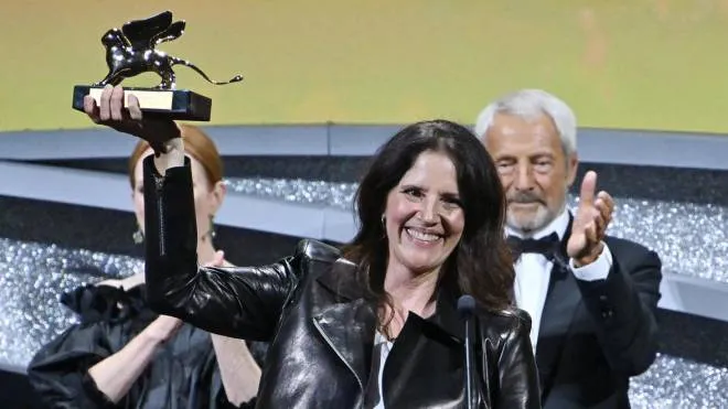US filmmaker Laura Poitras holds the Golden Lion award for his movie ' All the Beauty and the Bloodshed' during the closing ceremony of the 79th annual Venice International Film Festival, in Venice, Italy, 10 September 2022. The 79th edition of the festival runs from 31 August to 10 September 2022.   ANSA/ETTORE FERRARI
