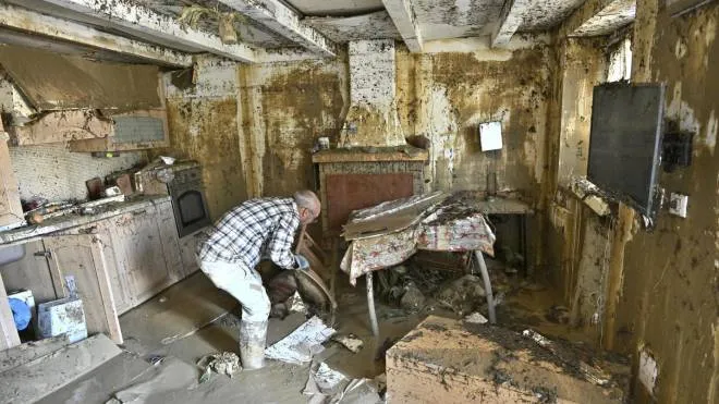 A man clears mud off his property in the aftermath of flash floods caused by an overnight rain bomb, in Pianello di Ostra, Ancona province, central Italy, 16 September 2022. At least 10 people died following flash floods due to rain bombs and heavy winds in the province of Ancona.
ANSA/ALESSANDRO DI MEO