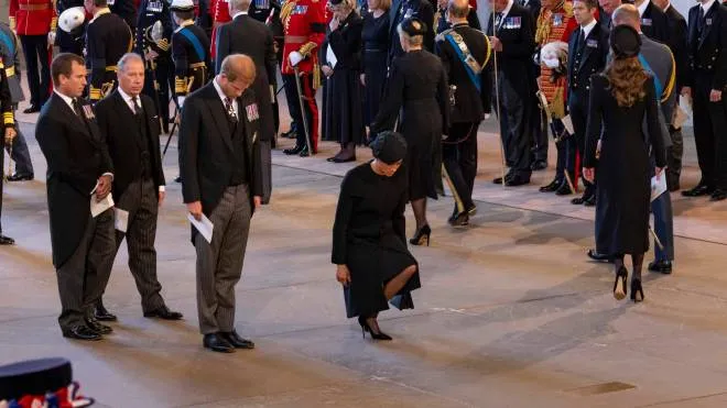 epa10184699 A handout photograph released by the UK Parliament shows Britain's Prince Harry, Duke of Sussex (C-L) and Meghan, Duchess of Sussex (C-R) attending the service for the commencement of the Lying-in-State of Britain's Queen Elizabeth II at the Palace of Westminster in London, Britain, 14 September 2022. The queen's lying in state will last for four days, ending on the morning of the state funeral on the 19 September.  EPA/UK PARLIAMENT/ROGER HARRIS HANDOUT -- MANDATORY CREDIT: UK PARLIAMENT/ROGER HARRIS -- HANDOUT EDITORIAL USE ONLY/NO SALES
