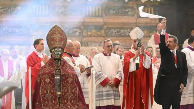 The archbishop of Naples Domenico Battaglia holds a vial believed to contain the blood of the 3rd century saint San Gennaro (Saint Januarius) during the so-called liquefaction miracle, in the Chapel of the Treasury, in Naples, Italy, 19 September 2022. Faithful gather three times a year to witness the liquefaction of the otherwise coagulated blood of the saint. ANSA/Ciro Fusco