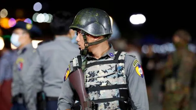 epa10232827 An armed police stands guard inside the people park during the fullmoon day of Thadinkyut festival (end of Buddhist lent) in Yangon, Myanmar, 09 October 2022. Thadinkyut festival, also called Lighting Festival, is held to mark the full moon day of the Burmese Lunar month of Thadingyut on 24 October, which is the end of Buddhist lent, and is the celebration to welcome the Buddha's descent from heaven.  EPA/NYEIN CHAN NAING