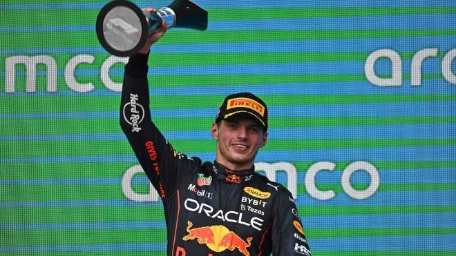Red Bull Racing's Dutch driver Max Verstappen celebrates on the podium after winning the Formula One United States Grand Prix, at the Circuit of the Americas in Austin, Texas, on October 23, 2022. (Photo by Patrick T. FALLON / AFP)