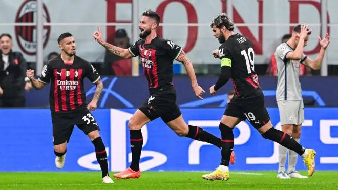 AC Milan's French forward Olivier Giroud (2ndL) celebrates after opening the scoring during the UEFA Champions League Group E football match between AC Milan and RB Salzburg on November 2, 2022 at the San Siro stadium in Milan. (Photo by MIGUEL MEDINA / AFP)