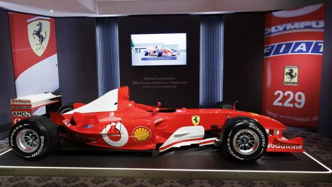 The Formula One Ferrari F2003 GA chassis number 229 with which Germany's F1 driver Michael Schumacher won his sixth World Championship title, is displayed during a preview at Sotheby's before auction sale, in Geneva, Switzerland, 04 November 2022. The red racing car is estimated to fetch between 7,5 to 9,5 million Swiss francs (CHF), between 7.44 million to 9.43 million US dollar, or between 7.61 to 9.63 million euros. ANSA/SALVATORE DI NOLFI