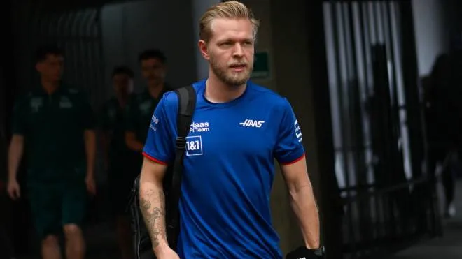 Hass Danish driver Kevin Magnussen arrives to the paddock area at the Interlagos racetrack in Sao Paulo, Brazil, on November 11, 2022, two days ahead of the 2022 Brazil Formula One Grand Prix. (Photo by MAURO PIMENTEL / AFP)