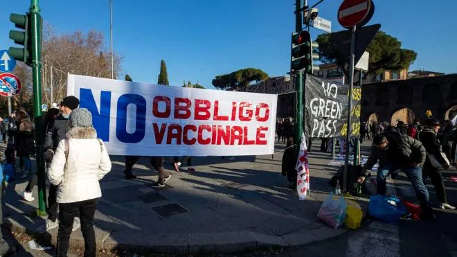 People gather during the 'No Vax and No Green Pass' protest at San Giovanni square, in Rome, Italy, 15 January 2022. In Italy it is now necessary to have the so-called Super Green Pass, which shows that a person is vaccinated for COVID-19 or has recovered from it on the last six months, to access bars, restaurants, hotels and travel on buses, subways, trains, planes and ships. Furthermore, the government has also made the Super Green Pass obligatory for all over-50s as they are considered especially vulnerable if they contract the virus. ANSA/MASSIMO PERCOSSI