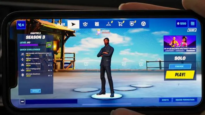 epa08623375 The 'launch screen' of the video game Fortnite, seen on an Apple iPhone X in Billerica, Massachusetts, USA, 24 August 2020. Epic Games Inc., the maker of the popular game Fortnite, is in a legal battle with Apple Inc., NASDAQ: APPL, following the removal of the game from the iOS App Store over a dispute on the distribution of income from in-app purchases of the game Fortnite.  EPA/CJ GUNTHER
