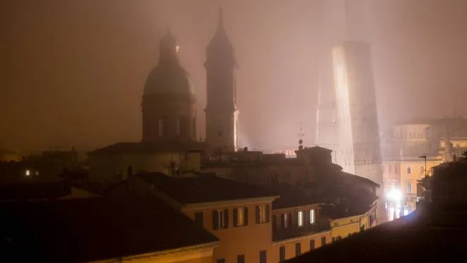 Aereal Bologna Two Towers and roofs in the night fog