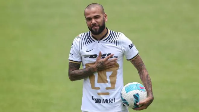 epa10088479 Brazilian defender Dani Alves reacts during his presentation as new player of the Pumas socccer team, in Mexico City, Mexico, 23 July 2022. Alves, 39, agreed with Pumas to play the Torneo Apertura as he is focused on being part of the Brazilian national team for the World Cup 2022.  EPA/Sashenka Gutierrez
