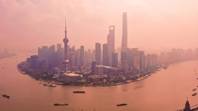 Shanghai China-Sep10 2019:Drone shot 4K Aerial view of Shanghai skyline with fog pollution environmental problem view near the