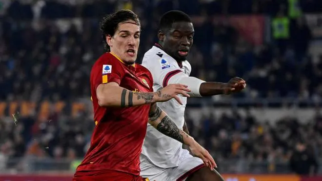 Roma's Nicolo' Zaniolo (L) in action against Bologna's Adama Soumaoro (R) during the Serie A soccer match between AS Roma and Bologna FC at the Olimpico stadium in Rome, Italy, 4 January 2023. ANSA/RICCARDO ANTIMIANI