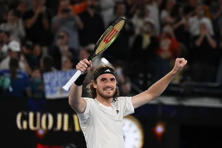 Greece's Stefanos Tsitsipas celebrates after victory against Czech Republic's Jiri Lehecka in their men's singles quarter-final match on day nine of the Australian Open tennis tournament in Melbourne on January 24, 2023. (Photo by WILLIAM WEST / AFP) / -- IMAGE RESTRICTED TO EDITORIAL USE - STRICTLY NO COMMERCIAL USE --