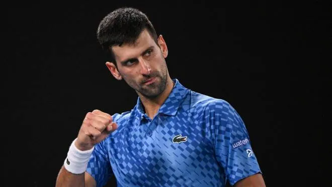 Serbia's Novak Djokovic reacts after a point against Greece's Stefanos Tsitsipas during the men's singles final on day fourteen of the Australian Open tennis tournament in Melbourne on January 29, 2023. (Photo by WILLIAM WEST / AFP) / -- IMAGE RESTRICTED TO EDITORIAL USE - STRICTLY NO COMMERCIAL USE --