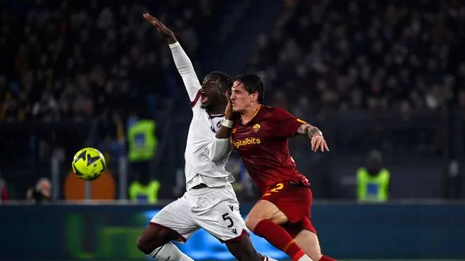 Bologna's Adama Soumaoro (L) in action against Roma�??s Nicolo' Zaniolo (R) during the Serie A soccer match between AS Roma and Bologna FC at the Olimpico stadium in Rome, Italy, 4 January 2023. ANSA/RICCARDO ANTIMIANI