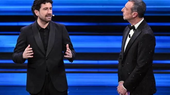 Sanremo Festival host and artistic director Amadeus (R) with Italian actor Alessandro Siani (L) on stage at the Ariston theatre during the 73rd Sanremo Italian Song Festival, in Sanremo, Italy, 09 February 2023. The music festival will run from 07 to 11 February 2023.  ANSA/ETTORE FERRARI
