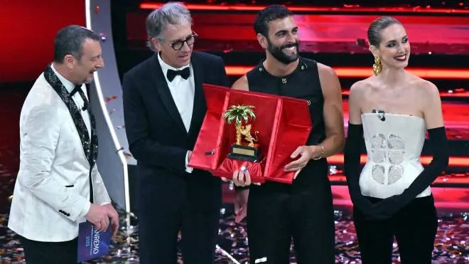 Italian singer Marco Mengoni (2R) poses with the trophy with Sanremo Festival host and artistic director Amadeus (L), mayor of Sanremo, Alberto Biancheri (2L), and Italian fashion blogger, businesswoman and model, Chiara Ferragni (R) on stage at the Ariston theatre after winning the 73rd Sanremo Italian Song Festival, in Sanremo, Italy, 11 February 2023. The music festival will run from 07 to 11 February 2023.  ANSA/ETTORE FERRARI