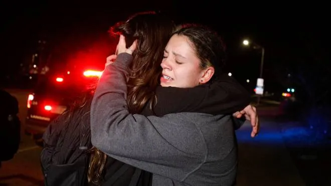 LANSING, MI - FEBRUARY 13: Michigan State University students hug during an active shooter situation on campus on February 13, 2023 in Lansing, Michigan. Five people were shot and the gunman still at large following the attack, according to published reports. The reports say some of the victims have life-threatening injuries.   Bill Pugliano/Getty Images/AFP (Photo by BILL PUGLIANO / GETTY IMAGES NORTH AMERICA / Getty Images via AFP)