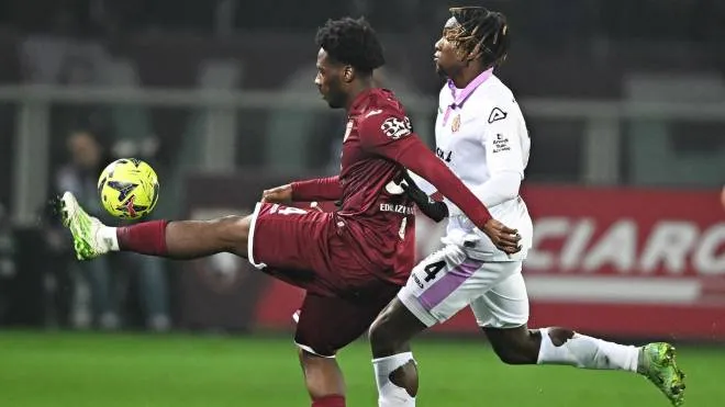 Torino's Temitayo Aina and Cremonese's Emanuel Aiwu in action during the Italian Serie A soccer match Torino FC vs US Cremonese at the Olimpico Grande Torino Stadium in Turin, Italy, 20 february 2023 ANSA/ALESSANDRO DI MARCO