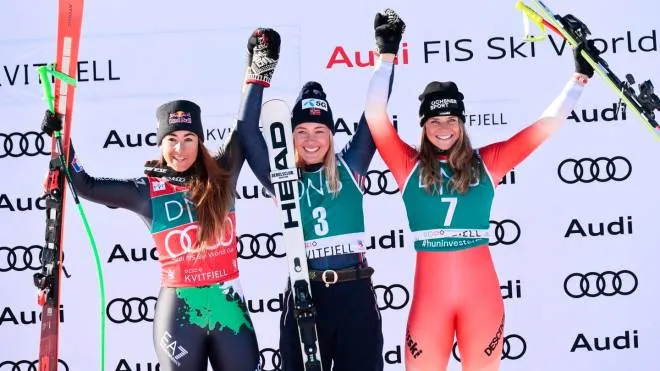 epa10502332 (L-R) Second placed Sofia Goggia from Italy, winner Kajsa Vickhoff Lie of Norway ad third placed Corinne Suter from Switzerland celebrate on the podium for Women's Downhill race at the FIS Alpine Skiing World Cup in Kvitfjell, Norway, 04 March 2023.  EPA/Geir Olsen  NORWAY OUT