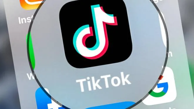 (FILES) This file photo taken on March 24, 2022, shows the logo of networking application TikToK displayed on a tablet in Lille, northern France. - The Canadian government on February 27, 2023, banned TikTok from all of its phones and other devices, citing concerns about data protection. TikTok, whose parent company ByteDance is Chinese, has faced increasing Western scrutiny in recent months over fears about how much access Beijing has to user data. (Photo by DENIS CHARLET / AFP)