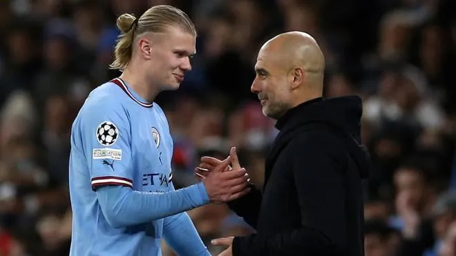 epa10523030 Manchester City's manager Pep Guardiola (R) and Erling Haaland (L) shake hands during the UEFA Champions League Round of 16, 2nd leg match between Manchester City and RB Leipzig in Manchester, Britain, 14 March 2023.  EPA/Adam Vaughan