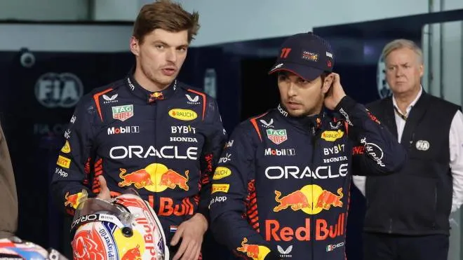 epa10503185 First placed Dutch Formula One driver Max Verstappen of Red Bull Racing (L) and second placed Mexican Formula One driver Sergio Perez of Red Bull Racing (R) react after the qualifying session for the Formula One Grand Prix of Bahrain at the Bahrain International Circuit in Sakhir, Bahrain, 04 March 2023. The Formula One Grand Prix of Bahrain takes place on 05 March.  EPA/Ali Haider