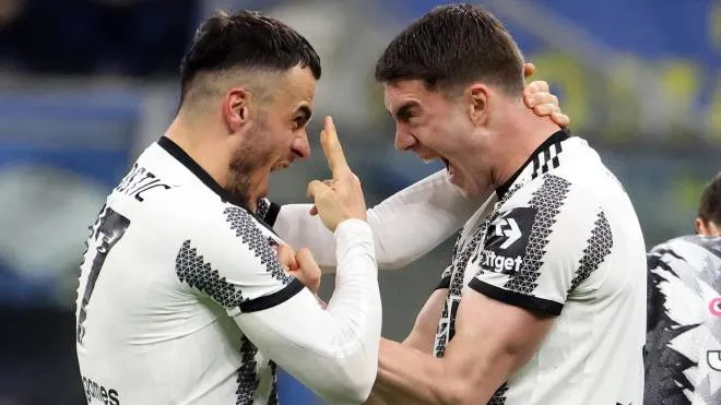Juventus�s Filip Kostic (L) jubilates with his teammate Dusan Vlahovic  after scoring goal of 0 to 1 during the Italian serie A soccer match between Fc Inter  and Juventus  Giuseppe Meazza stadium in Milan, 19 March  2023.
ANSA / MATTEO BAZZI