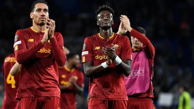 Roma's English forward Tammy Abraham (R) and Roma's English defender Chris Smalling (L) applaud at the end of the UEFA Europa League last 16 second leg football match between Real Sociedad and  AS Roma at the Reale Arena stadium in San Sebastian on March 16, 2023. (Photo by ANDER GILLENEA / AFP)