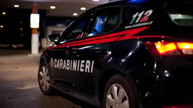Padua, Italy - December 25, 2019. Italian Carabinieri car parked in the street, during security activity. Italian Carabinieri has Seat Leon  as patrol car for public aid and security activity. Night shot.
