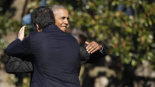 President Barack Obama hugs Italian Prime Minister Matteo Renzi during a state arrival ceremony, Tuesday, Oct. 18, 2016, on the South Lawn of the White House in Washington. (ANSA/AP Photo/Pablo Martinez Monsivais)