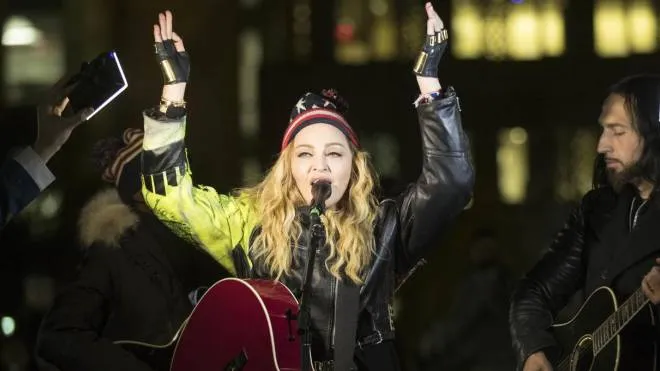 Madonna campaigns for Democratic presidential candidate Hillary Clinton during a surprise performance at Washington Square Park in New York, Monday, Nov. 7, 2016. (ANSA/AP Photo/Matt Rourke) [CopyrightNotice: Copyright 2016 The Associated Press. All rights reserved.]