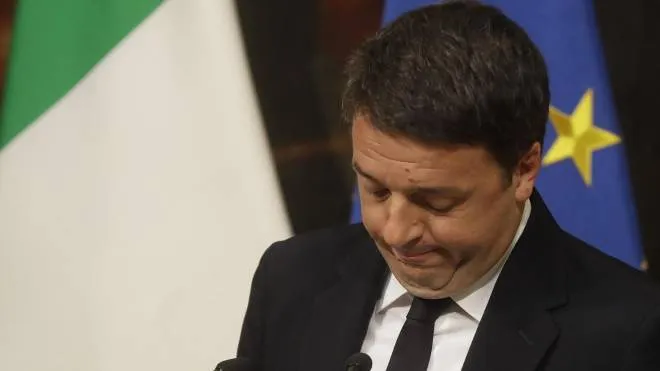 Italian Premier Matteo Renzi speaks during a press conference at the premier's office Chigi Palace in Rome, early Monday, Dec. 5, 2016. Renzi acknowledged defeat in a constitutional referendum and announced he would resign on Monday. Italians voted Sunday in a referendum on constitutional reforms that Premier Matteo Renzi has staked his political future on. (ANSA/AP Photo/Gregorio Borgia) [CopyrightNotice: Copyright 2016 The Associated Press. All rights reserved.]