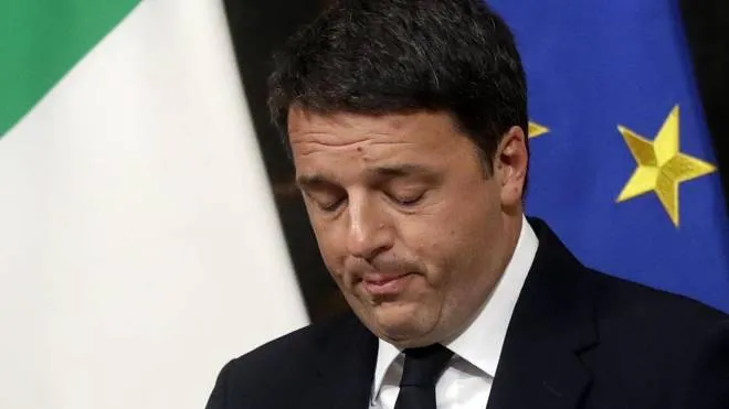Italian Premier Matteo Renzi speaks during a press conference at the premier's office Chigi Palace in Rome, early Monday, Dec. 5, 2016. Renzi acknowledged defeat in a constitutional referendum and announced he will resign on Monday. Italians voted Sunday in a referendum on constitutional reforms that Premier Matteo Renzi has staked his political future on. (ANSA/AP Photo/Gregorio Borgia) [CopyrightNotice: Copyright 2016 The Associated Press. All rights reserved.]