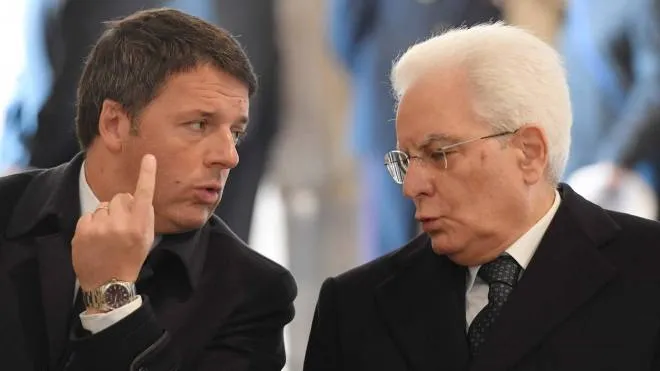 (FILES) This file photo taken on November 20, 2016 shows Italy's President Sergio Mattarella (R) speaking with Italys' Prime Minister Matteo Renzi before a ceremony for the closing of the Jubilee of Mercy, on November 20, 2016 at St Peter's basilica in Vatican. Italian Prime Minister Matteo Renzi prepared to hand in his resignation on December 5, 2016 after suffering a ruinous referendum defeat that was cheered by populist leaders and sparked fresh jitters across Europe. / AFP PHOTO / POOL / TIZIANA FABI