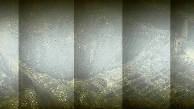 This handout combination of video grabs from Tokyo Electric Power Co. (Tepco) taken on January 30, 2017 and released on February 2, 2017 shows the inside of the No. 2 reactor, just below the pressure vessel, at TEPCO's Fukushima Dai-ichi nuclear power plant in Okuma town, Fukushima prefecture. 
Radiation levels inside the stricken reactor at Japan's Fukushima nuclear plant have hit a record high capable of shutting down robots, in the latest challenge to efforts aimed at dismantling the disaster-hit facility. Radiation levels inside the plant's No. 2 reactor were estimated at 530 sieverts per hour at one spot, Tokyo Electric Power Co (TEPCO) said on February 2 after analysing images taken by a manually operated camera that probed the deepest point yet within the reactor.
 / AFP PHOTO / TEPCO / Handout / RESTRICTED TO EDITORIAL USE - MANDATORY CREDIT "AFP PHOTO /TEPCO " - NO MARKETING - NO ADVERTISING CAMPAIGNS - DISTRIBUTED AS A SERVICE TO CLIENTS