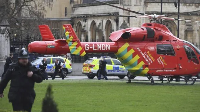 An Air Ambulance on the scene after sounds similar to gunfire have been heard close to the Houses of Parliament, London, Wednesday, March 22, 2017. The UK House of Commons sitting has been suspended as witnesses report sounds like gunfire outside. (Victoria Jones/PA via AP)
