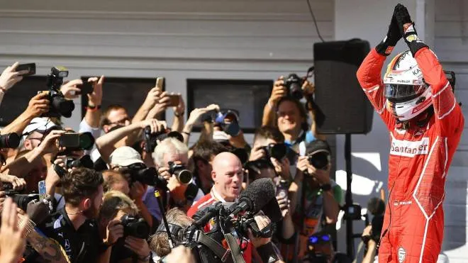 epa06117479 German Formula One driver Sebastian Vettel of Scuderia Ferrari celebrates after winning the 32nd Hungarian Formula One Grand Prix on the Hungaroring racetrack in Mogyorod, Hungary, 30 July 2017.  EPA/ZSOLT CZEGLEDI HUNGARY OUT
