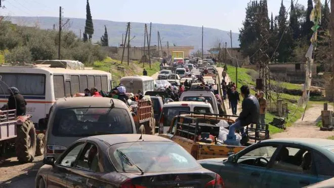 Syrian civilians ride their cars through Ain Dara in the northern Afrin region as they flee Afrin city on March 12, 2018 amid battles between Turkish-backed forces and Kurdish fighters.

Hundreds of civilians fled a Turkish-led advance on Syria's Kurdish-majority city of Afrin on March 12, the Syrian Observatory for Human Rights said, adding that &quot;more than 2,000 civilians have arrived in the area of Nubul&quot; controlled by pro-regime forces after fleeing the city.
 / AFP PHOTO / STRINGER