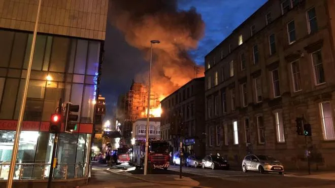 Flames and smoke rise from the Glasgow School of Art's Mackintosh Building in London, early Saturday, June 16, 2018. A large blaze ripped through the building at the Glasgow School of Art late Friday, the second time in four years that fire has damaged the famed Scottish school. (Douglas Barrie/PA via AP) [CopyrightNotice: PA]