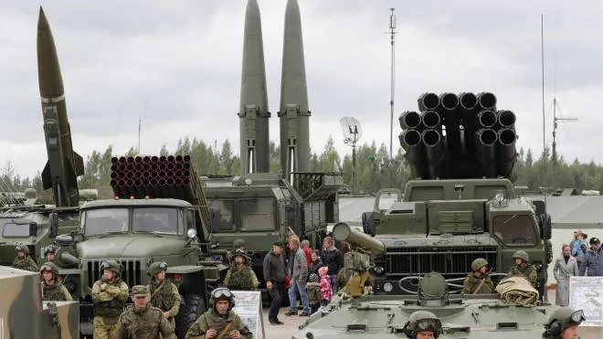 (FILE) - Visitors look at Russian tactical ballistic missile OTR-21 Tochka-U (L), 122mm multiple rocket launcher BM-21 Grad (2_L), tactical ballistic missile 9K720 Iskander-M (C) and 300mm multiple rocket launcher BM-30 Smerch (R) during a military exhibition marking the Tank's Day on a tank range in Luga, outside St. Petersburg, Russia, 09 September 2017 (reissued 20 October 2018). According to media reports, the Trump administration has told US allies that it wants to withdraw from the landmark Reagan-era Intermediate-range Nuclear Forces Treaty, or INF.