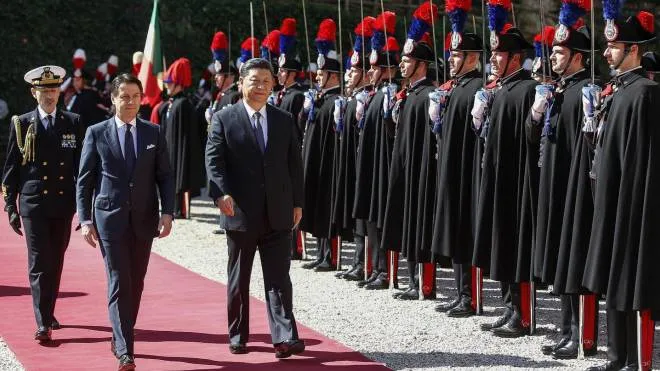Italian premier Giuseppe Conte (L)  and Chinese President Xi Jinping walk past the honor guards during a welcoming ceremony at the Villa Madama in Rome, Italy, 23 March 2019. President Xi Jinping is in Italy to sign a memorandum of understanding to make Italy the first Group of Seven leading democracies to join China's ambitious Belt and Road infrastructure project. 
 ANSA/RICCARDO ANTIMIANI