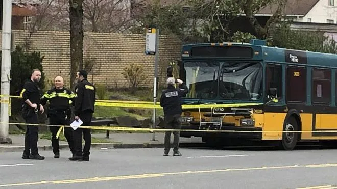 Investigators work on the scene of a shooting in Seattle on Wednesday, March 27, 2019. Authorities say four people, including a Metro bus driver, were shot and one person has been detained. (ANSA/AP Photo/Gene Johnson)