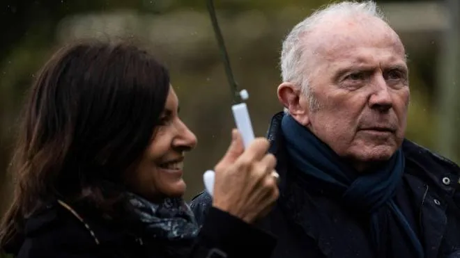 French businessman Francois Pinault (R), sponsor of the Hauteville House, and mayor of Paris Anne Hidalgo walk in the garden of the Hauteville house during a press visit on April 5, 2019 in Saint Peter Port, the capital of Guernsey island. - The Hauteville house was the residence of French writer Victor Hugo during his exile in Guernsey and also a work of art by its layout and decor, designed by Victor Hugo himself. (Photo by Lionel BONAVENTURE / AFP)