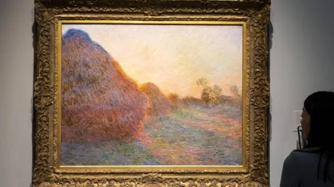 epa07544875 The 1890 painting 'Meules' by Claude Monet, estimated to sell for over 55 million USD, is on display during a preview of upcoming 'Impressionist and Modern Art' and 'Contemporary Art' auctions at Sotheby's in New York, New York, USA, 03 May 2019. The auctions take place in the middle of May.  EPA/JUSTIN LANE