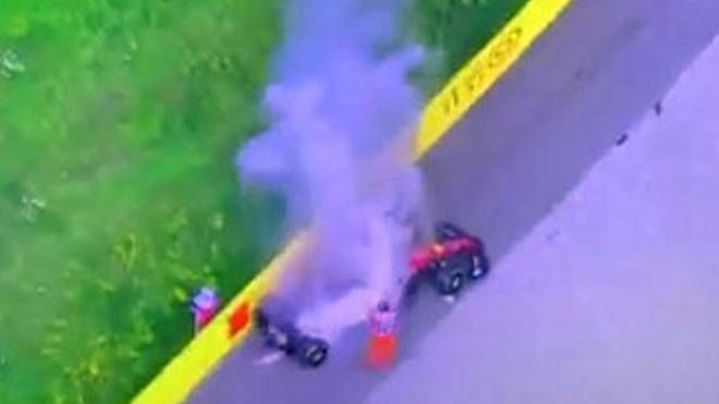 La Ferrari di Sainz in fiamme (Ansa, frame da YouTube)